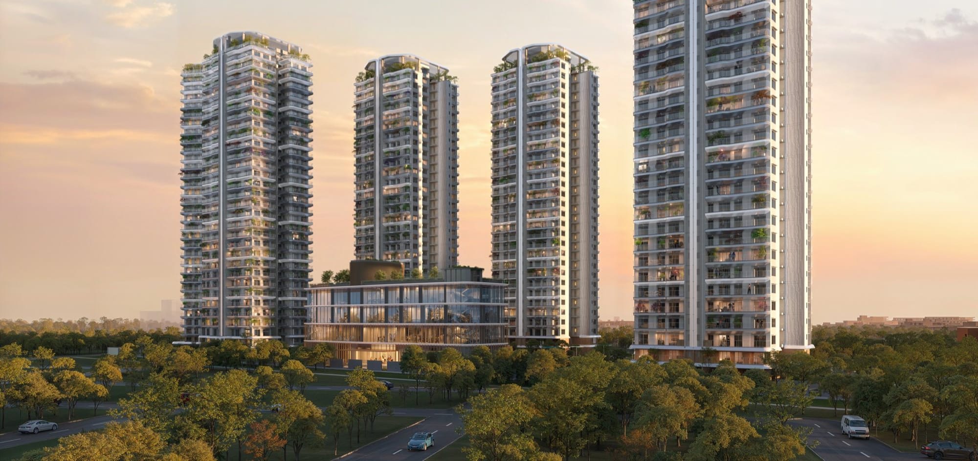Artist's impression of the Eldeco 7 Peaks towers and clubhouse above the trees at sunset